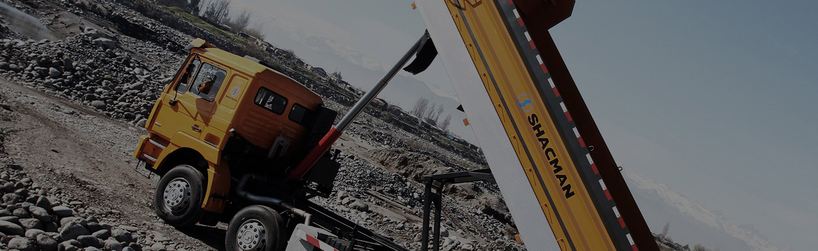 SHACMAN F3000 dump truck working on a quarry haul road